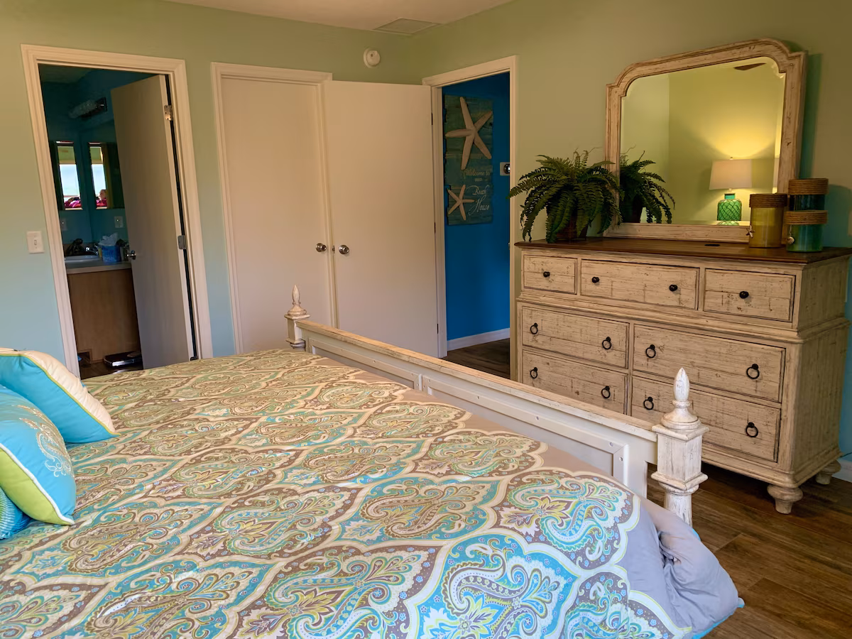 Master bedroom with 43 inch TV and dresser
